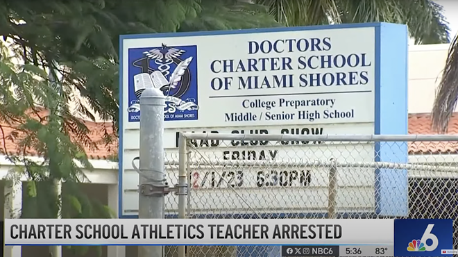 screenshot of news shot of sign outside the school
